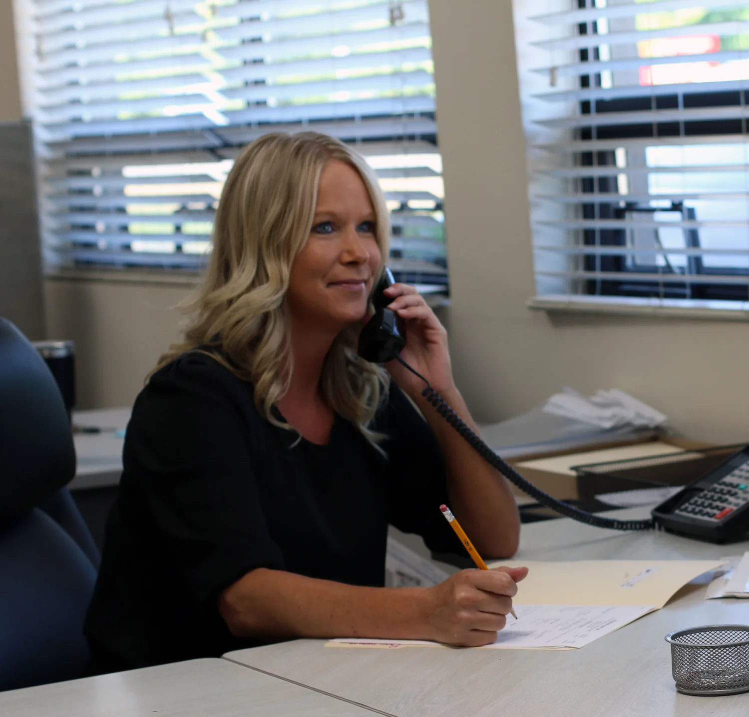 Peters Body Shop team member taking a phone call